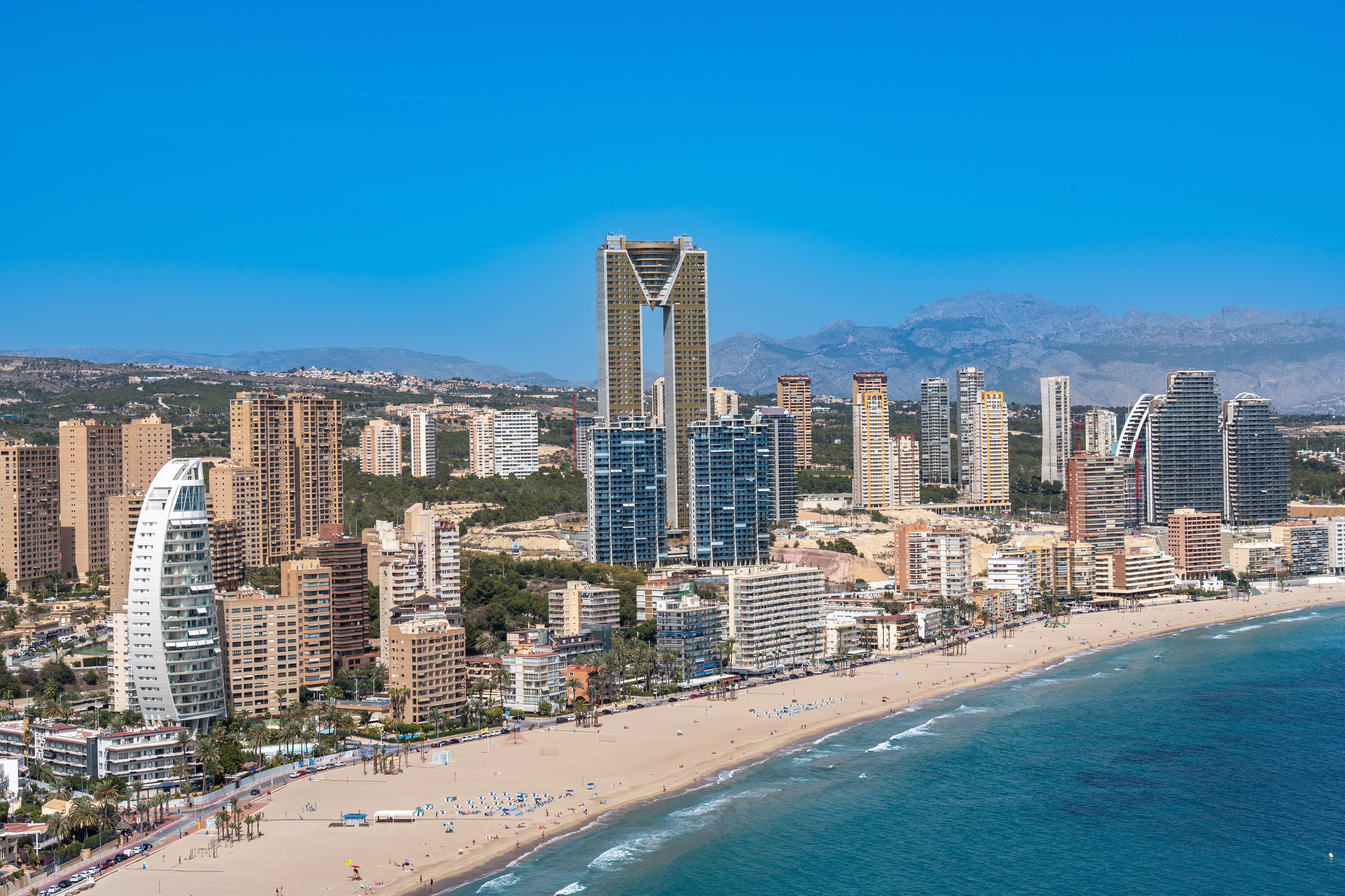 Aerial view of Benidorm's beachfront with iconic Intempo building.