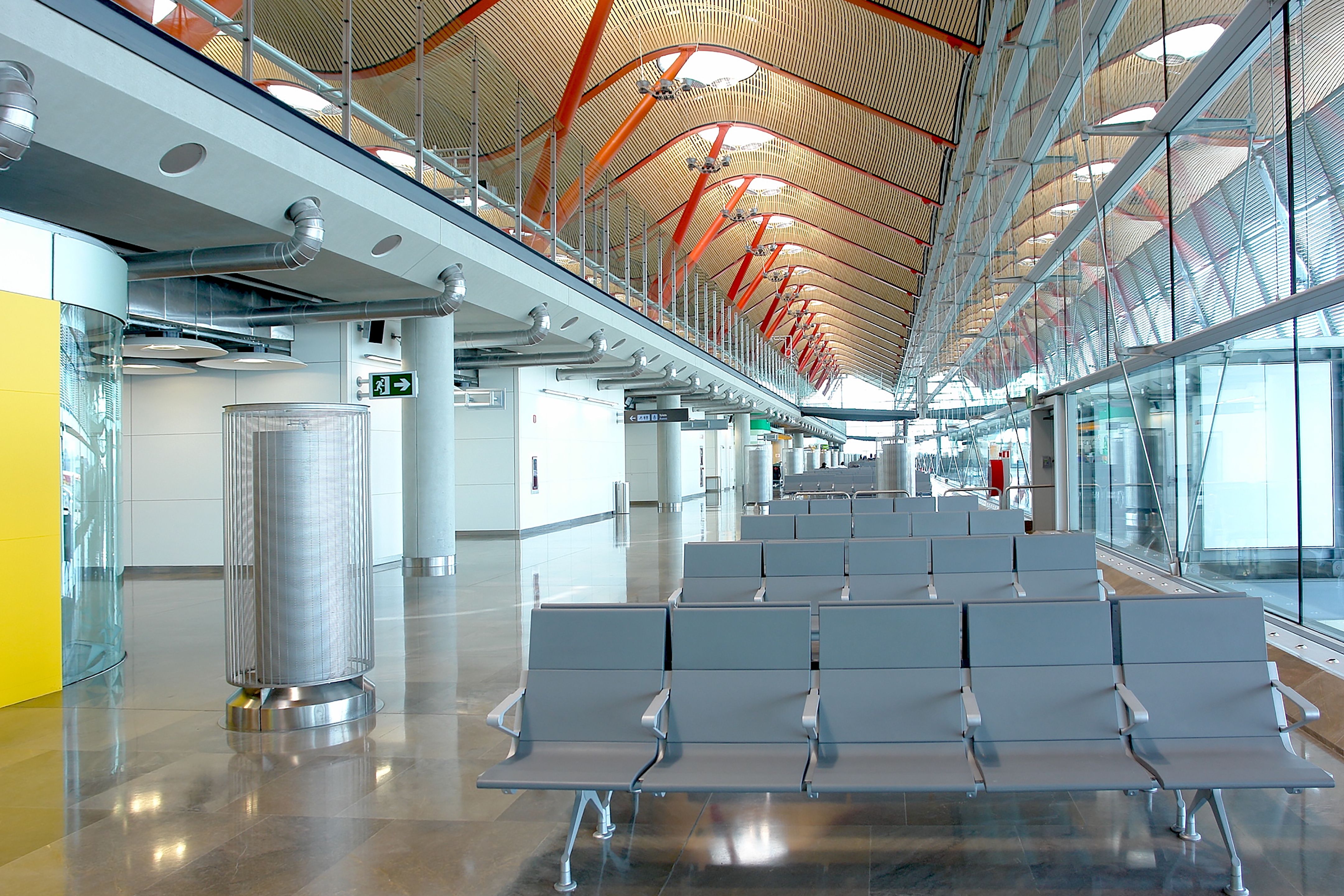 Sleek interior of Madrid Barajas Airport showcasing innovative modern architecture and spacious design.